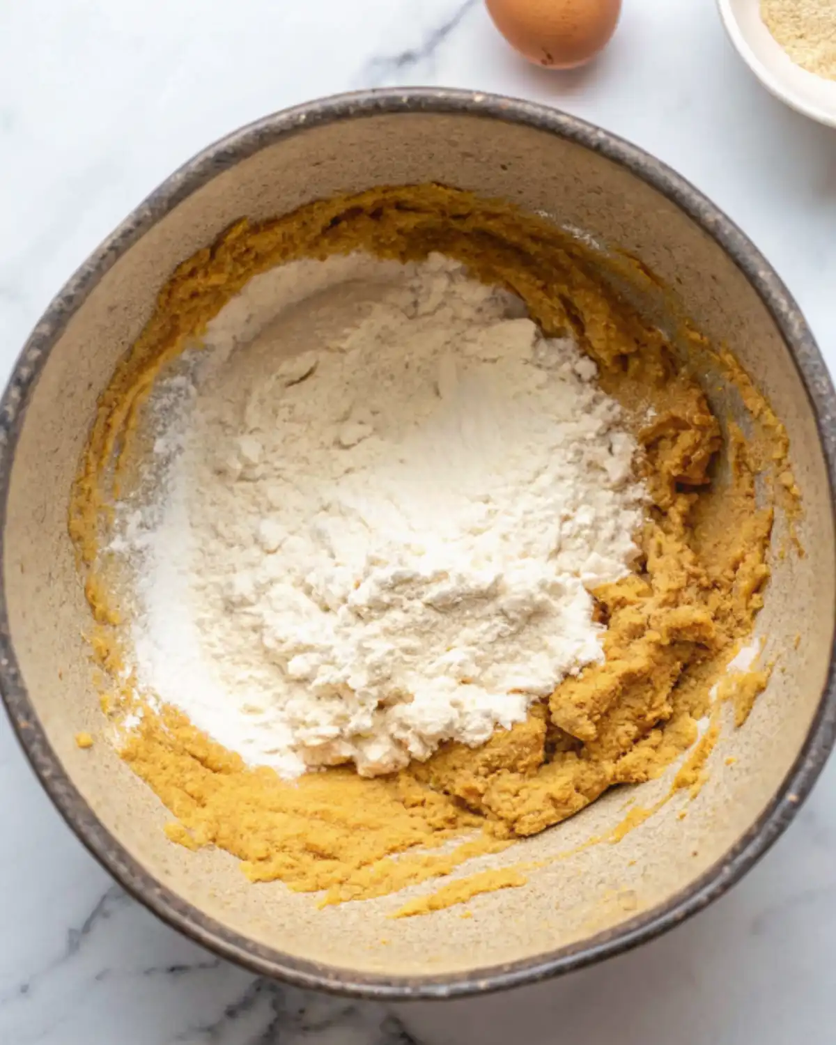 Flour and cookie dough mixture in a bowl